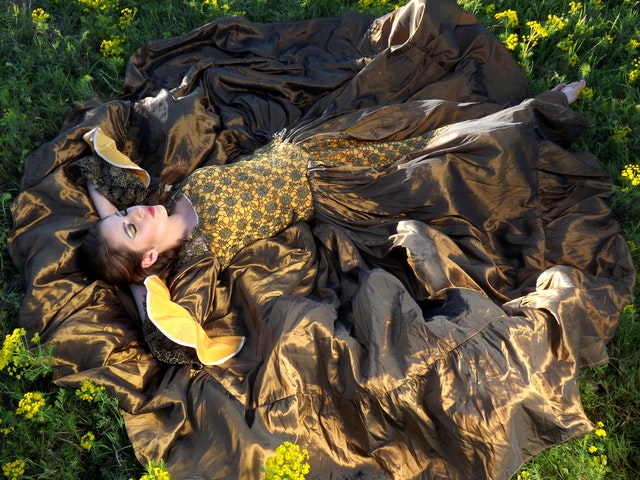 beautiful-woman-lying-on-the-ground